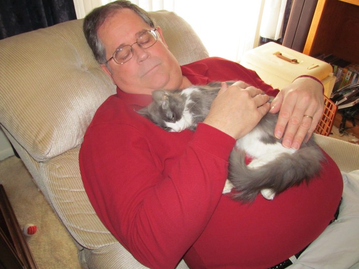 My husband comforting Missy the day before she passed away in March 2013